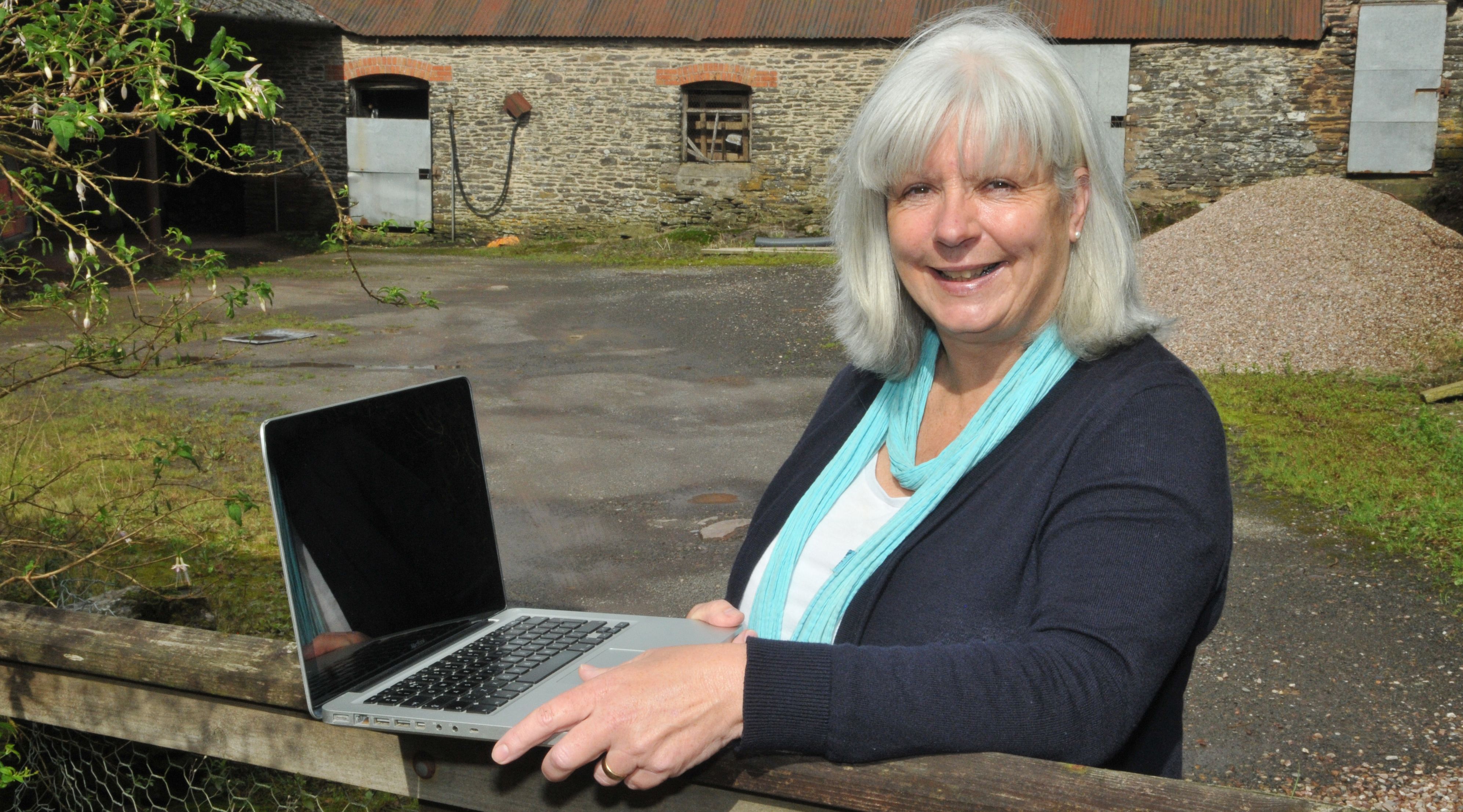 Business owner in rural area using fast broadband in Devon and Somerset