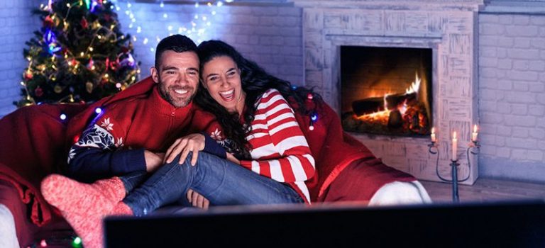 Couple streaming Christmas films on the fibre broadband connection