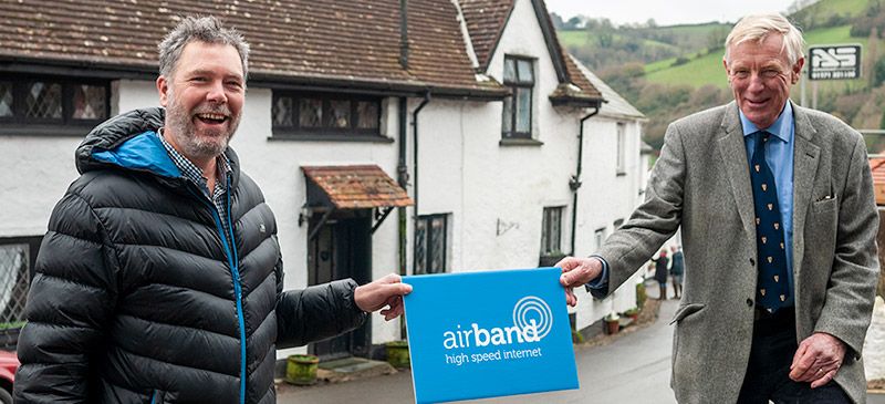 Airband Devon Project Manager with councillor Rufus Gilbert, Devon County Council Cabinet Member for Economy and Skills - celebrating in Berrynarbor - the first of a series of fibre broadband networks Airband is building in north Devon