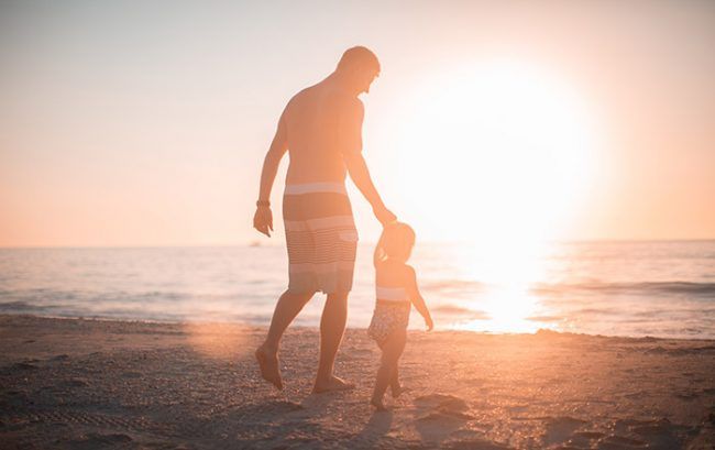 Father and child on a beach