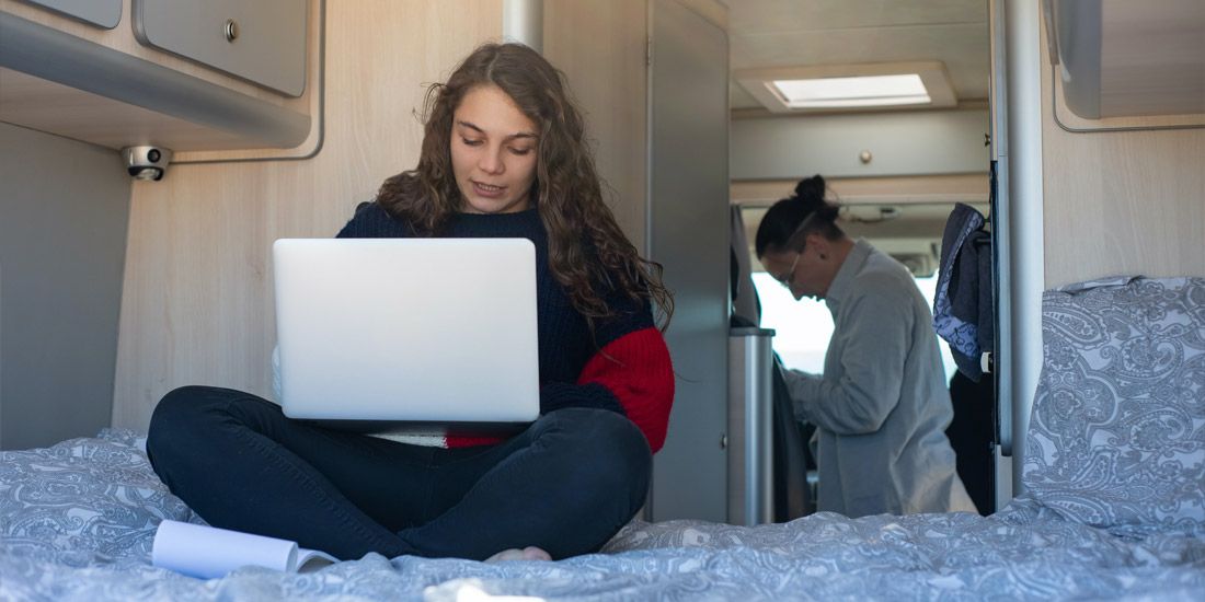 Girl using internet in a caravan
