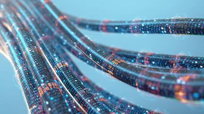 A closeup picture of several broadband cables with data running through them
