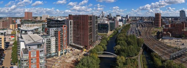 An aerial view of the canal going through Leeds city centre